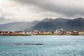 Andenes village panorama with multiple houses and mountains in the background, Lofoten islands, Andoy Municipality, Vesteralen