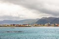 Andenes village panorama with multiple houses and mountains in the background, Lofoten islands, Andoy Municipality, Vesteralen