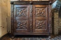 Anderlecht, Brussels Capital - Belgium - Detail of a wooden dark oak cupboard with ornaments