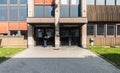 Anderlecht, Brussels Capital Region - Belgium - Teacher standing at the closed entrance of the CVO Brussel school during the