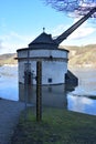 Andernach, Germany - 02 04 2021: Flood scale and Roman crane \' Alter Kahnen \' in the Rhine flood Royalty Free Stock Photo