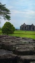 Andesite stone former paseban room in Ratu Boko temple with background, trees and gate