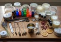 Andle-making setup featuring various materials and tools on a wooden Royalty Free Stock Photo