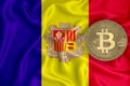 Andorra flag, bitcoin gold coin on flag background. The concept of blockchain, bitcoin, currency decentralization in the country.