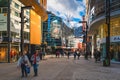 People duty free shopping, street with modern shops in Andorra