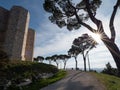 Sunset with sun rays shining through tree and Castel del Monte landmark