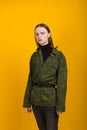 Androgen. Androgynous character on a yellow background. Man or woman. Military style