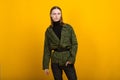 Androgen. Androgynous character on a yellow background. Man or woman. Military style
