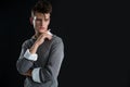 Androgynous man posing with hand on chin Royalty Free Stock Photo