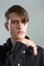 Androgynous man posing with hand on chin Royalty Free Stock Photo