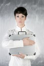 Androgynous woman holding silver briefcase