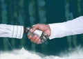 Android human handshake with forest green background Royalty Free Stock Photo