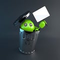 Android inside trash bin. Electronic recycle concept