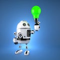 Android robot with green light bulb Royalty Free Stock Photo