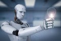 Android robot holding light bulb Royalty Free Stock Photo