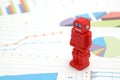 Android robots or artificial intelligence and graphs are written documents on white background.