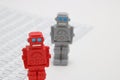 Android robots or artificial intelligence and numbers are written documents on white background.