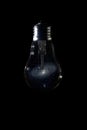 Andromeda Galaxy inside of light bulb on dark background Royalty Free Stock Photo