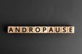 Andropause - word from wooden blocks with letters