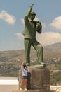 Andros, Greece 07 August 2018. Woman posing at the statue of the unknown sailor at Andros island