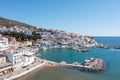 Andros island, Batsi village Cyclades destination Greece. Aerial drone view of port, boat, sea, sky Royalty Free Stock Photo