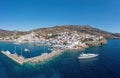 Andros island Batsi village Cyclades Greece. Aerial drone view of port, breakwater yacht, sea sky Royalty Free Stock Photo