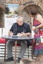 Andrzej Sapkowski sign a Witcher book for the fan