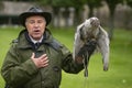 Andy Hughes, a professional resident Falconer demonstrates and explains the different hunting methods used by owls, hawks and Royalty Free Stock Photo