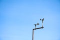 Anemometer in Meteorological weather station with blue sky background Royalty Free Stock Photo