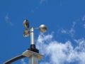 anemometer wind speed indicator measuring device under blue sky and clouds Royalty Free Stock Photo