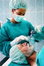 Anesthesiologist doctor anesthetized a surgical patient in hospital.