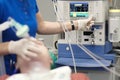 An anesthesiologist monitors the condition of a patient