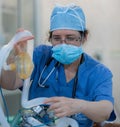 Anesthesiologist monitors patient during surgery