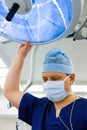 Anesthesiologist with surgical lamp