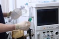 The anesthesiologist turns on the machine for artificial ventilation of the lungs. Surgery under anesthesia.Oxygen level sensor.