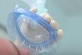 Anesthetic (oxygen) mask in front of the patient's face