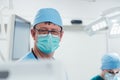 Anesthetist watching patient sleeping in operation room Royalty Free Stock Photo