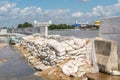 Dams from sand bags prevent flooding from river