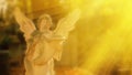 Angel antique statue in sunlight against blur background Royalty Free Stock Photo