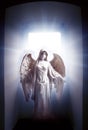 Angel archangel standing in mystic gate with divine rays of light like spiritual and religious concept
