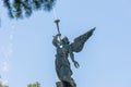 Angel blowing a trumpet figure in a water fountain in a park Royalty Free Stock Photo