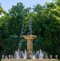 Angel blowing a trumpet figure in a water fountain in a park Royalty Free Stock Photo