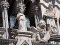 Statues of angel, lion and philosopher at Siena Cathedral Royalty Free Stock Photo