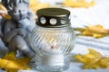 Angel and burning candle, leaves, white background Royalty Free Stock Photo