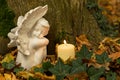 Angel with candle, nature cemetery Royalty Free Stock Photo