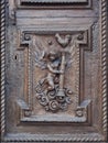 Angel carved on the wooden portal of an ancient Italian church Royalty Free Stock Photo