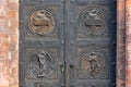 Angel carving on church doors in Berlin, Germany. Detail of the metallic panel on the temple doorway, entrance to the church.