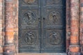 Angel carving on church doors in Berlin, Germany. Detail of the metallic panel on the temple doorway, entrance to the church.