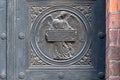 Angel carving on church doors in Berlin, Germany. Detail of the metallic panel on the temple doorway, entrance to the church. Royalty Free Stock Photo