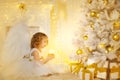 Angel Child and Christmas Tree with Presents Gifts, Kid Girl Royalty Free Stock Photo